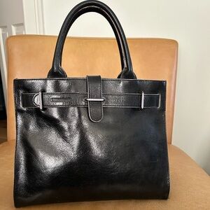 Furla black leather top handle bag.